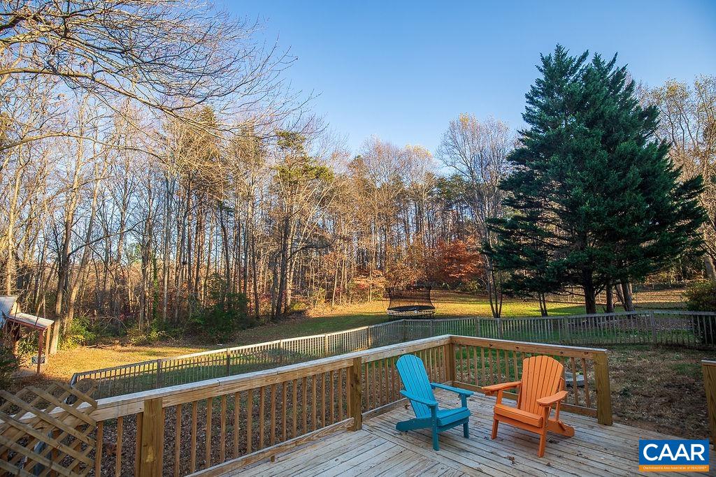 142 Rucker Drive Ruckersville, VA 22968 - Photo 15 of 19 a view of a wooden deck with trees