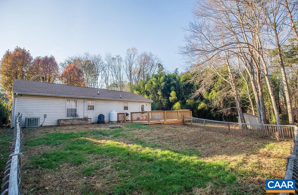 142 Rucker Drive Ruckersville, VA 22968 - Photo 3 of 19 a view of a backyard with a large tree