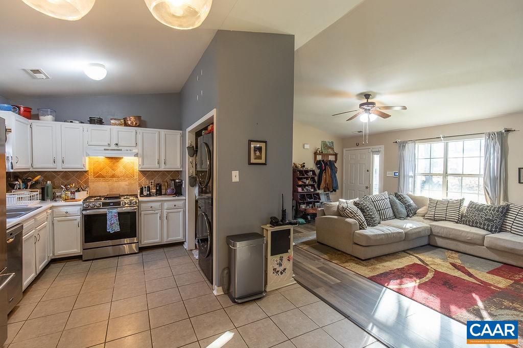 142 Rucker Drive Ruckersville, VA 22968 - Photo 7 of 19 a living room with granite countertop furniture and kitchen view
