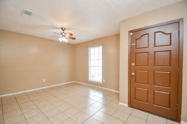 a view of an empty room with cabinet