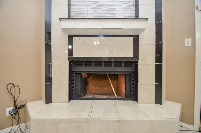 a room with fireplace and window