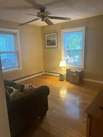 a living room with couch and a window