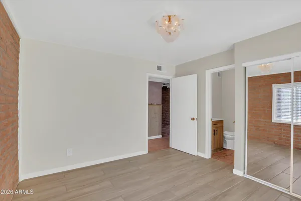 a bathroom with a sink toilet and mirror
