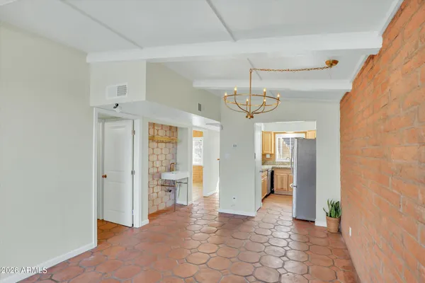 a view of a hallway with wooden shelves
