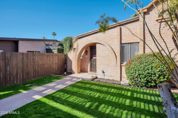 a view of a house with a yard and plants
