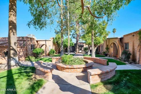 a view of a garden with a fountain