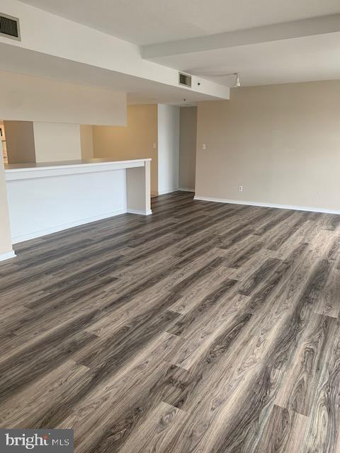 250 President Street, Unit 603 Baltimore, MD 21202 - Photo 2 of 40 a view of empty room with wooden floor