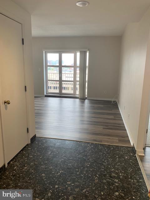 250 President Street, Unit 603 Baltimore, MD 21202 - Photo 27 of 40 wooden floor in an empty room with a window