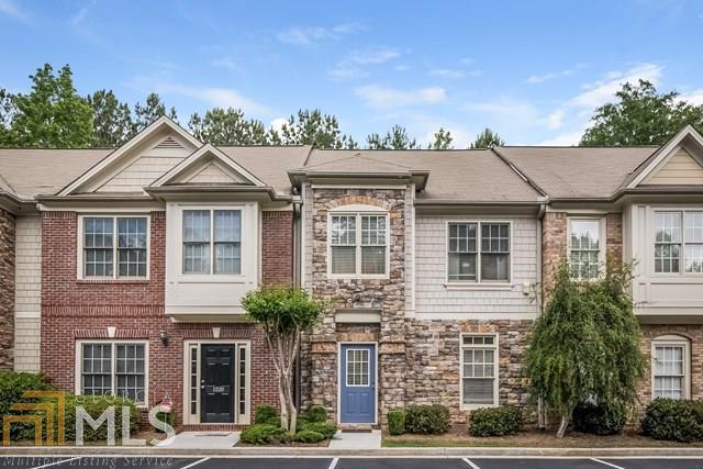 1222 Harris Commons Place Roswell, GA 30076 - Photo 1 of 1 a front view of a house with a yard