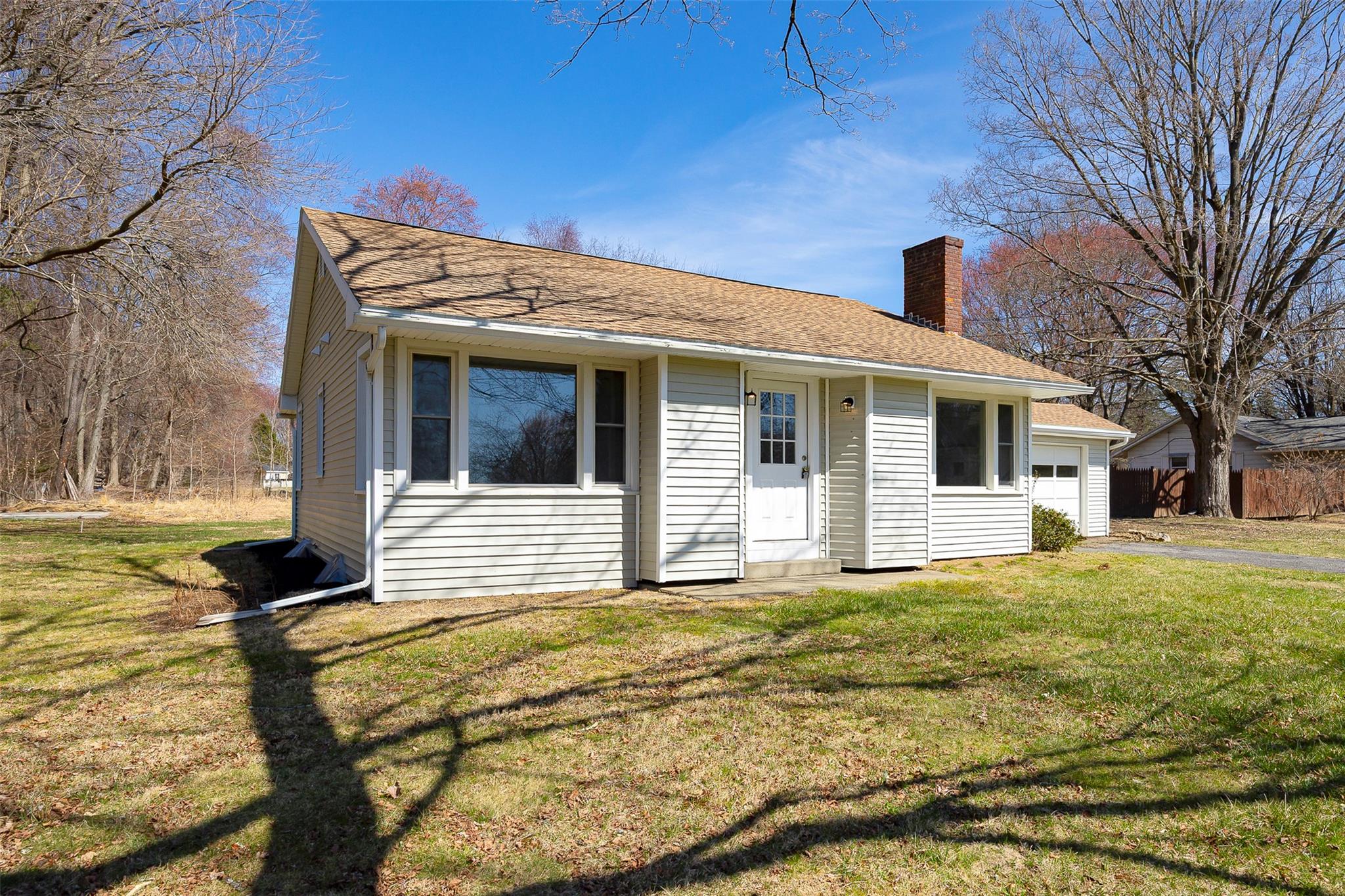 a view of a house with a house in the background