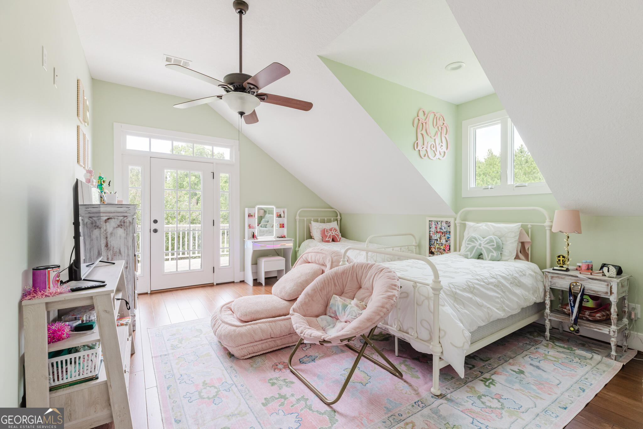 1859 Upper River Road Americus, GA 31709 - Photo 35 of 47 a bedroom with a bed and a chandelier