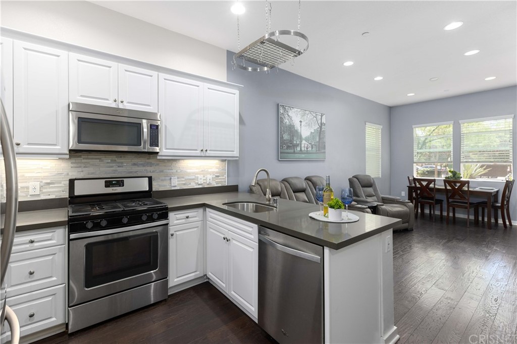 4951 Ash Avenue, Unit E Montclair, CA 91763 - Photo 16 of 41 a kitchen with sink cabinets and stove top oven