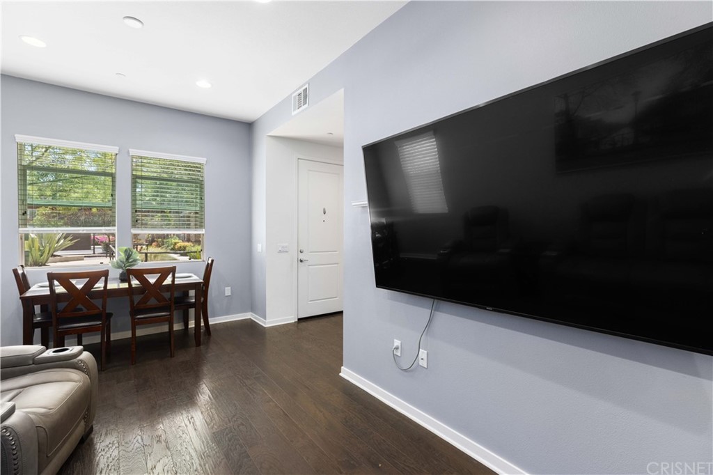 4951 Ash Avenue, Unit E Montclair, CA 91763 - Photo 19 of 41 a living room with furniture and a flat screen tv