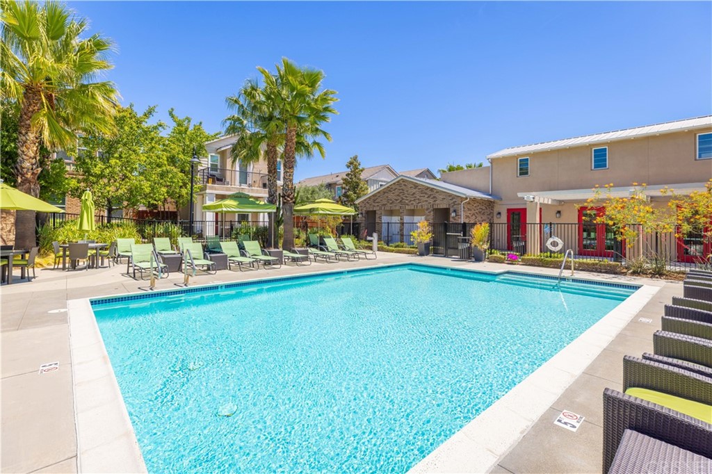 4951 Ash Avenue, Unit E Montclair, CA 91763 - Photo 31 of 41 a swimming pool view with a outdoor seating