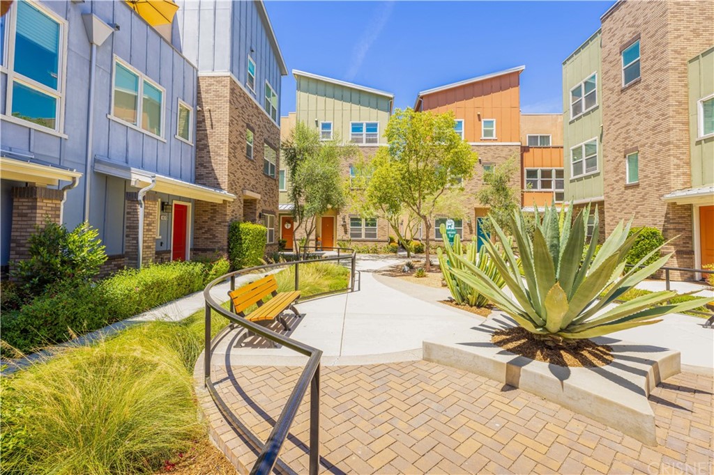 4951 Ash Avenue, Unit E Montclair, CA 91763 - Photo 4 of 41 a view of a swimming pool with a lounge chair
