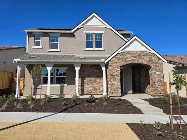 a front view of a house with yard