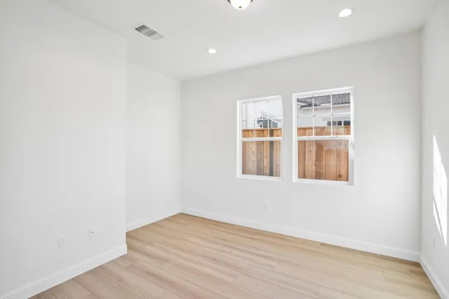 a view of a hallway with an empty room