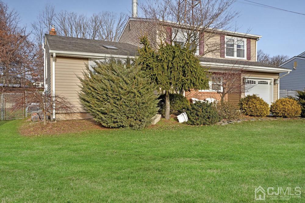 46 Brookside Road Edison, NJ 08817 - Photo 2 of 38 a front view of a house with garden