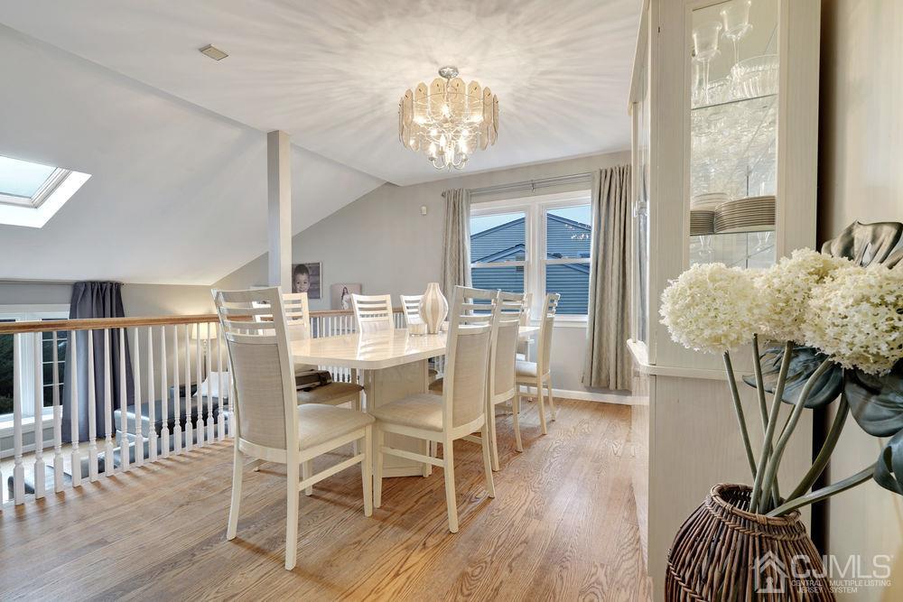 46 Brookside Road Edison, NJ 08817 - Photo 11 of 38 a dining room with furniture a chandelier and wooden floor