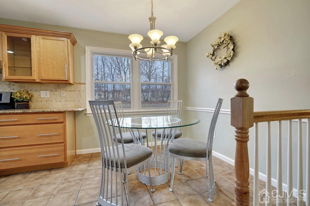 46 Brookside Road Edison, NJ 08817 - Photo 16 of 38 a dining room with furniture and window