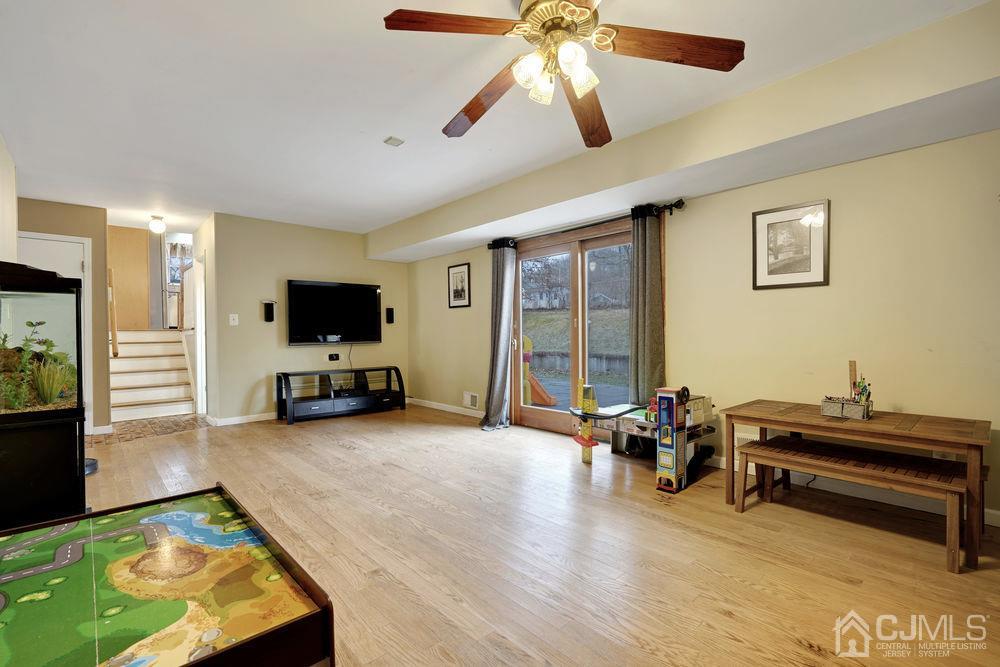 46 Brookside Road Edison, NJ 08817 - Photo 19 of 38 a view of a livingroom with furniture and a flat screen tv