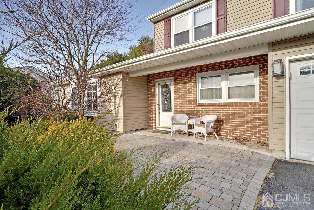 46 Brookside Road Edison, NJ 08817 - Photo 3 of 38 a backyard of a house with outdoor seating
