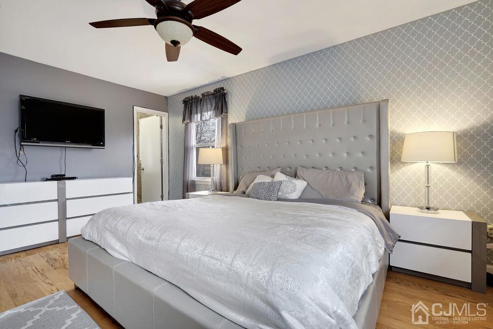46 Brookside Road Edison, NJ 08817 - Photo 23 of 38 a bedroom with a bed and a flat screen tv
