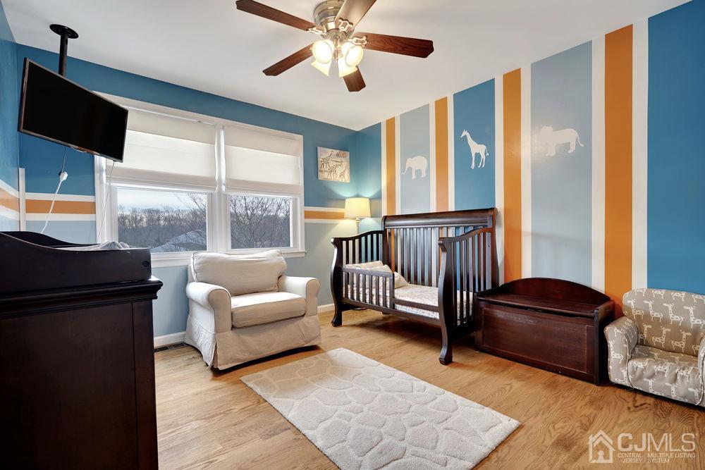46 Brookside Road Edison, NJ 08817 - Photo 27 of 38 a living room with furniture and a window