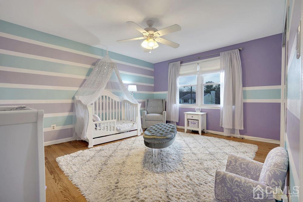 46 Brookside Road Edison, NJ 08817 - Photo 28 of 38 a living room with furniture and a chandelier