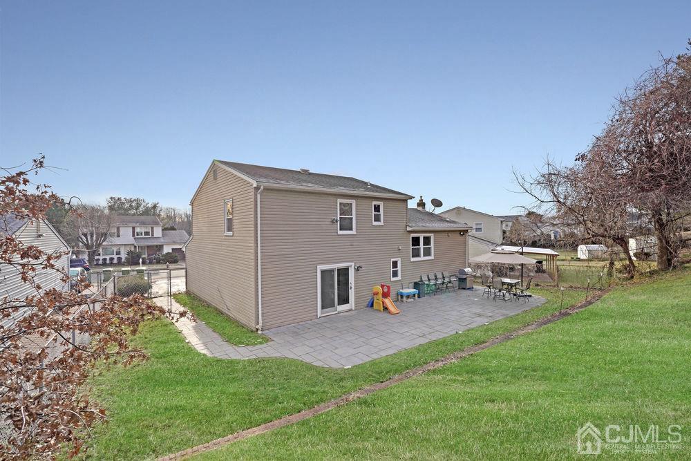 46 Brookside Road Edison, NJ 08817 - Photo 38 of 38 a view of a house with a yard and sitting area