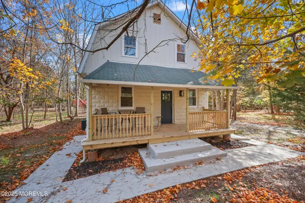 a kitchen with stainless steel appliances a sink a stove a refrigerator and cabinets