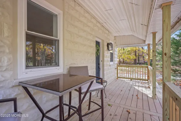 a kitchen with granite countertop a refrigerator and a stove top oven