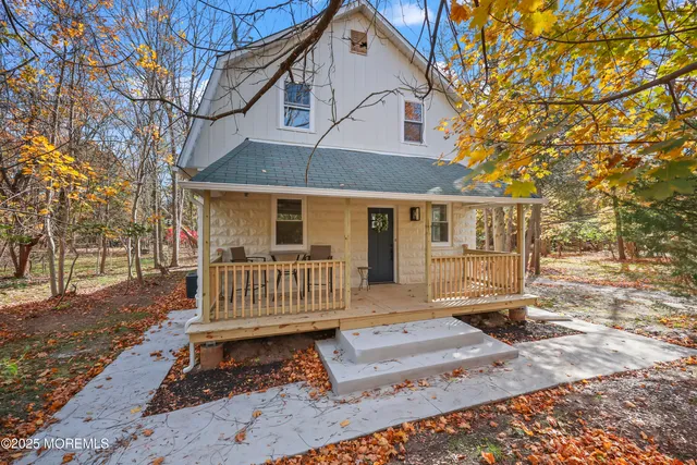a kitchen with stainless steel appliances a sink a stove a refrigerator and cabinets
