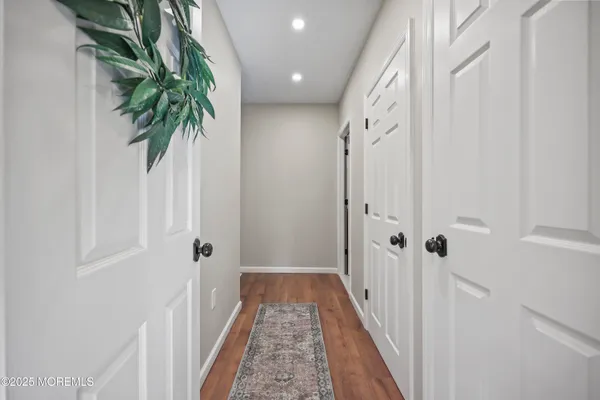 a bathroom with a sink mirror and a bathtub