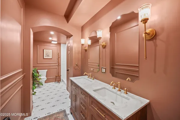 a bathroom with a sink a mirror and a shower