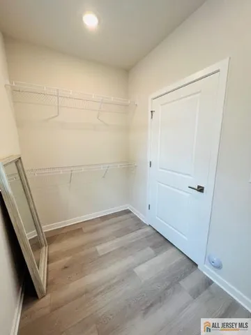 a view of front door with wooden floor