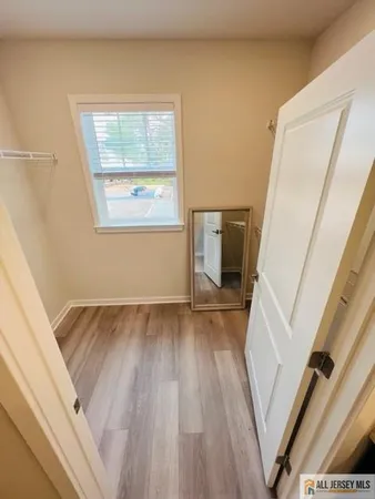 a dining room with furniture a rug and wooden floor