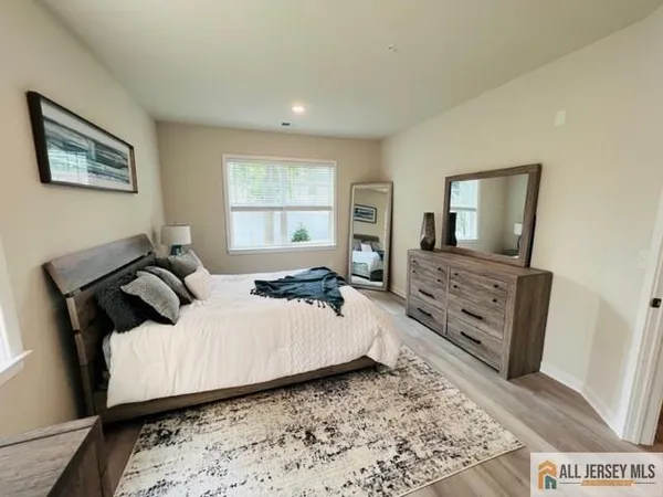 a bedroom with a bed and furniture