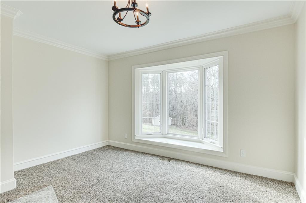 5064 Bunch Road Summerfield, NC 27358 - Photo 19 of 46 Enjoy views of the pond from this Office/Study on main level