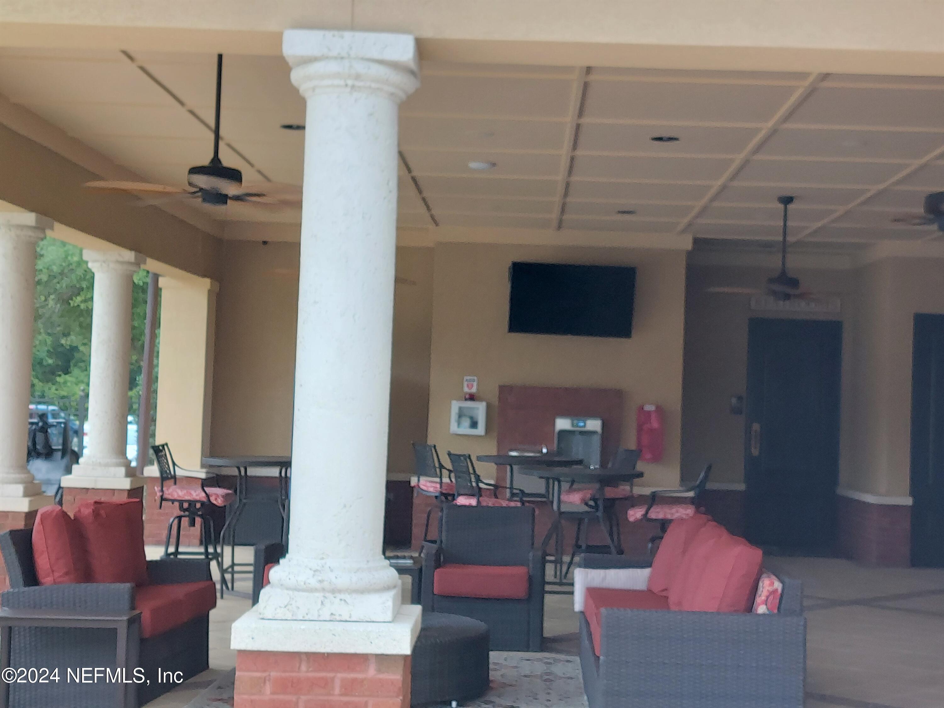 182 Nelson Lane St. Johns, FL 32259 - Photo 27 of 32 a living room with furniture and a flat screen tv