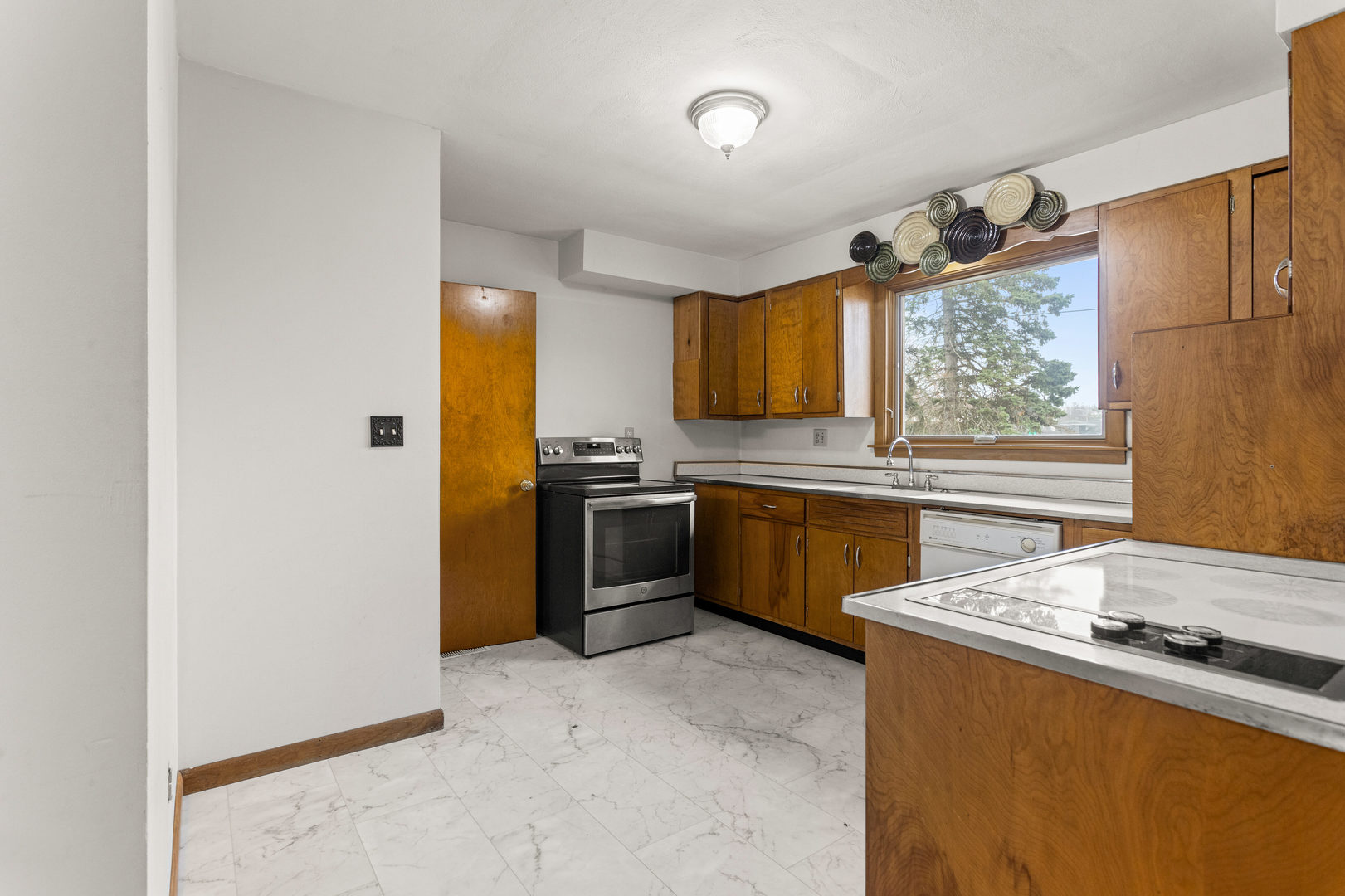 904 West Kirby Avenue Champaign, IL 61821 - Photo 11 of 46 a kitchen with a sink appliances and windows