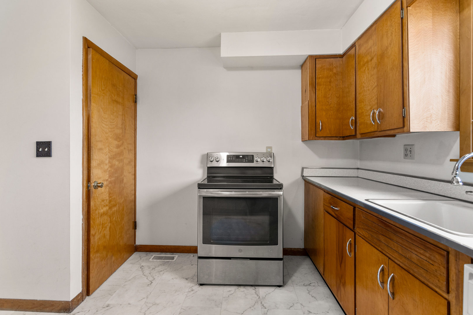 904 West Kirby Avenue Champaign, IL 61821 - Photo 13 of 46 a kitchen with stainless steel appliances granite countertop a stove and a microwave