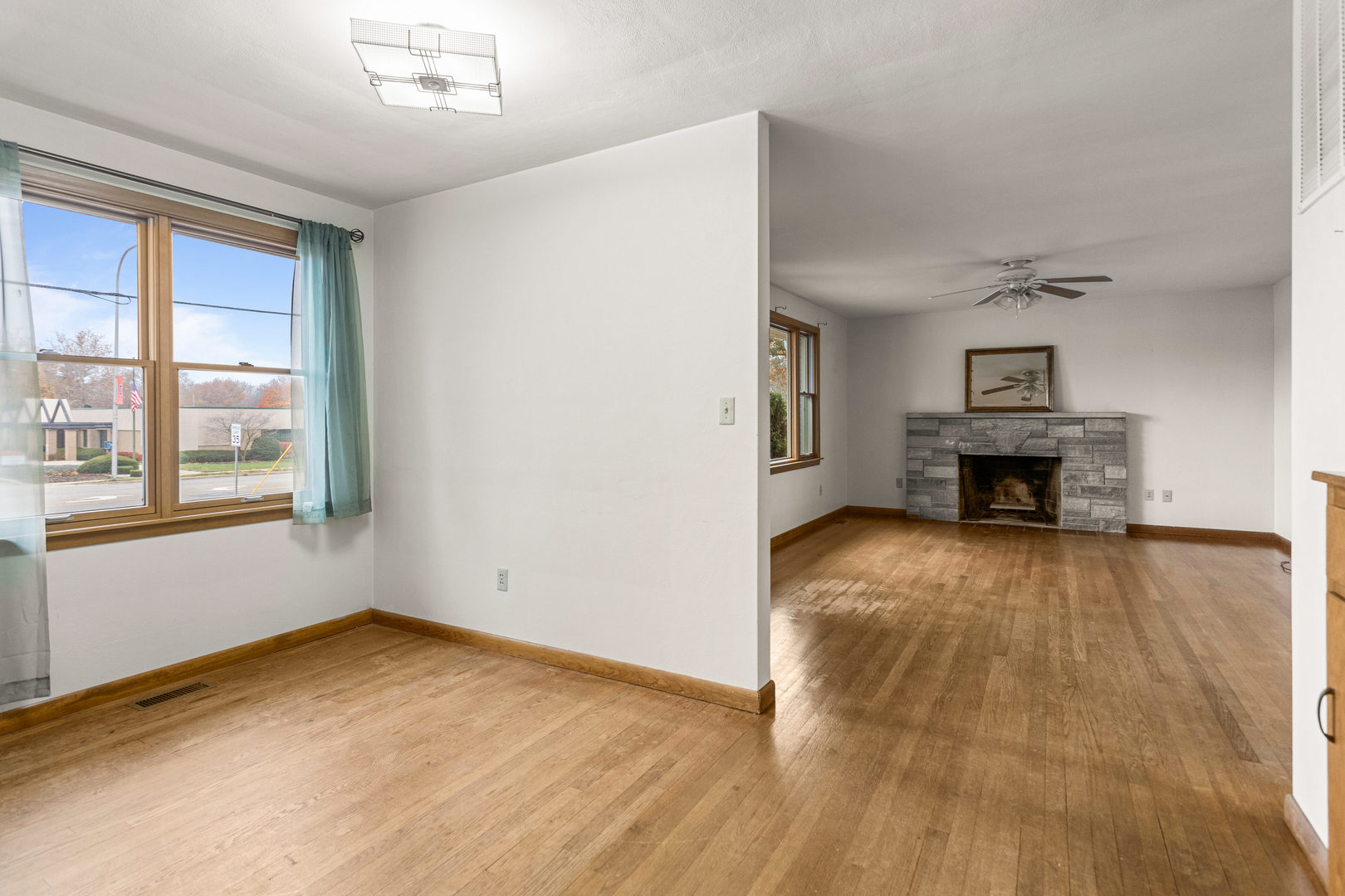 904 West Kirby Avenue Champaign, IL 61821 - Photo 15 of 46 a view of empty room with wooden floor and fireplace
