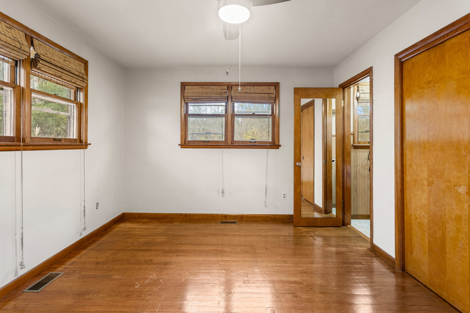 904 West Kirby Avenue Champaign, IL 61821 - Photo 19 of 46 wooden floor in an empty room with a window