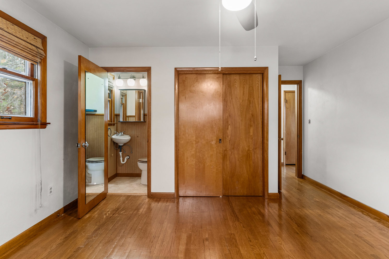 904 West Kirby Avenue Champaign, IL 61821 - Photo 20 of 46 a view of a room with wooden floor bathroom and mirror