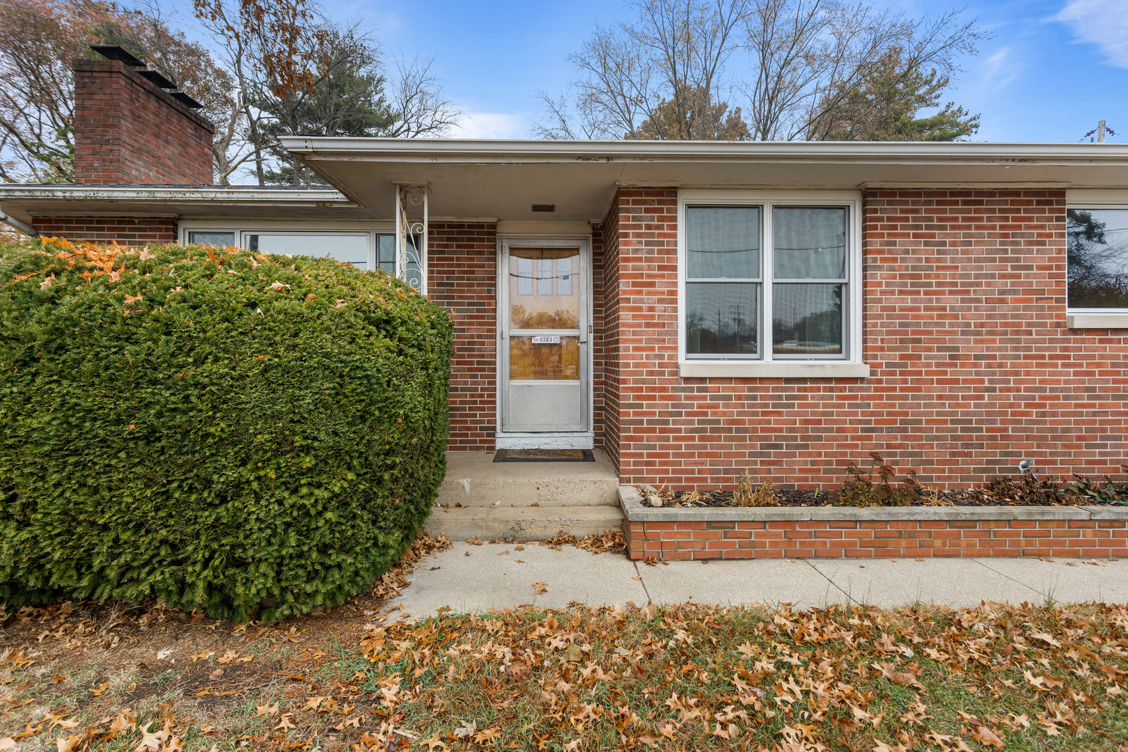 904 West Kirby Avenue Champaign, IL 61821 - Photo 2 of 46 a front view of a house with garden