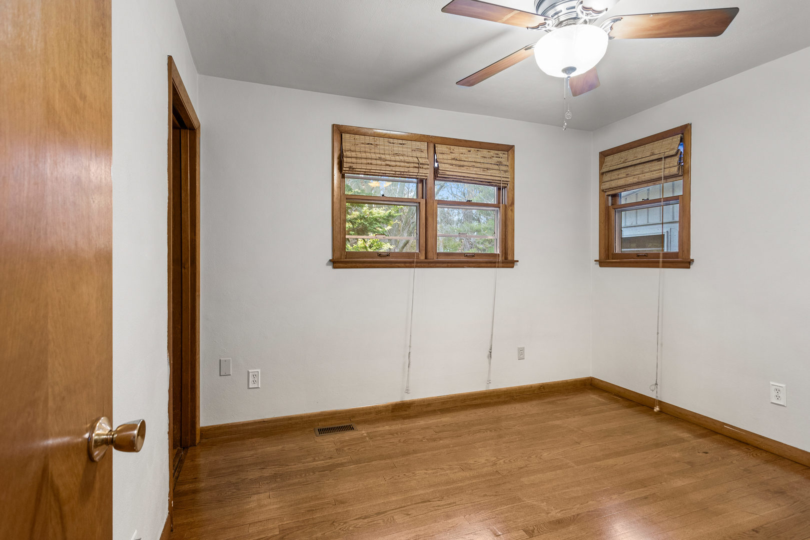 904 West Kirby Avenue Champaign, IL 61821 - Photo 22 of 46 wooden floor in an empty room with a window