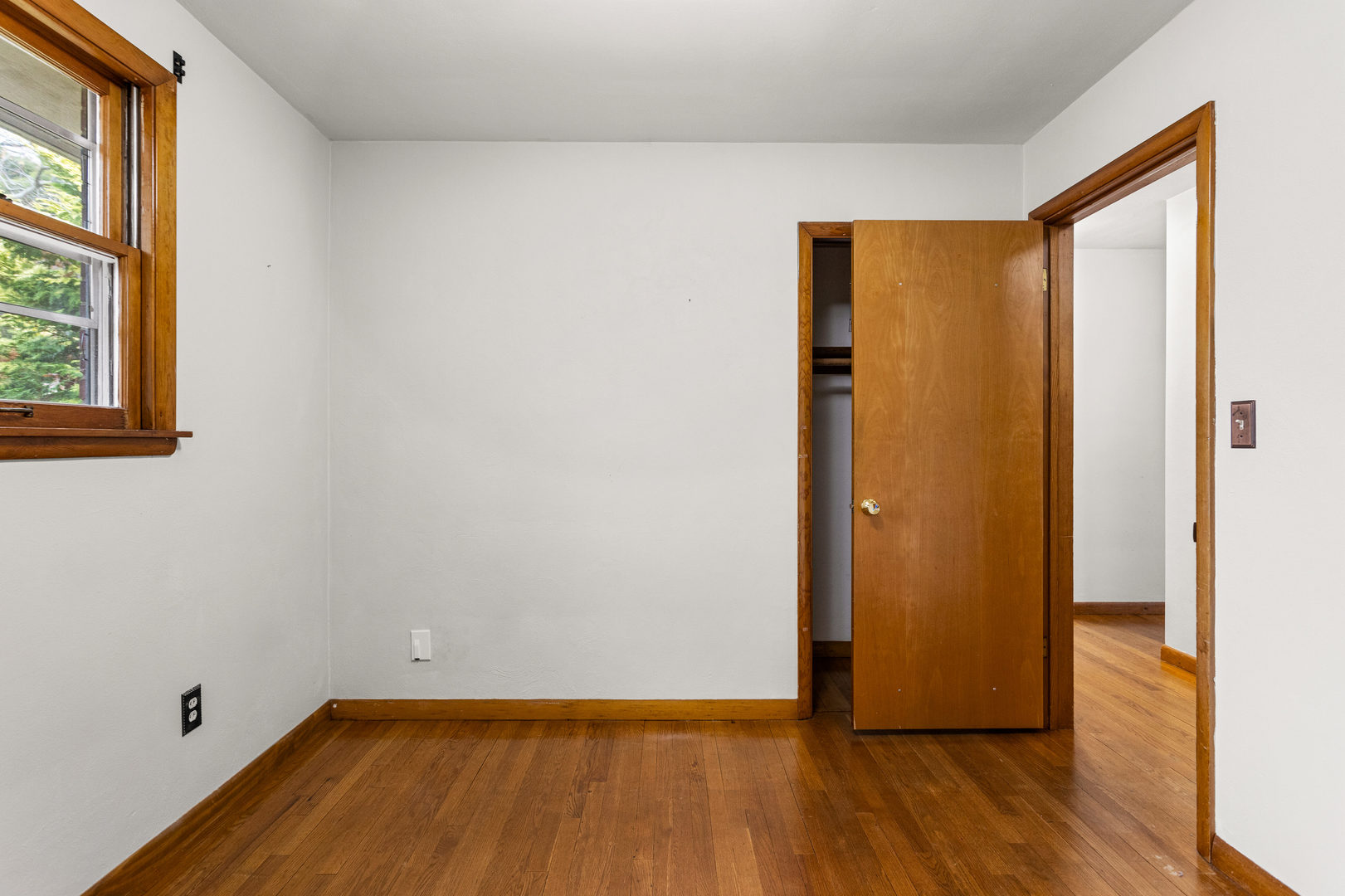 904 West Kirby Avenue Champaign, IL 61821 - Photo 26 of 46 a view of a room with wooden floor and a window