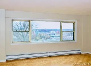 a view of a living room with a large window