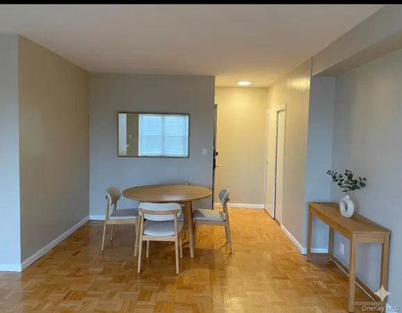 a dining room with furniture and window